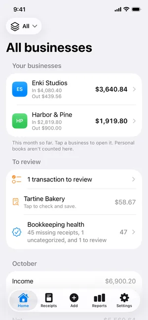 The Home screen: this month’s profit for two businesses, a receipt to review and bookkeeping health